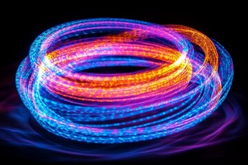 Colorful light trails create mesmerizing patterns in a dark space during a creative light art session