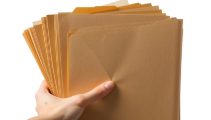 Hand holding manila file folders isolated on transparent or white background, png
