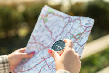 Tourist with compass and map in the city