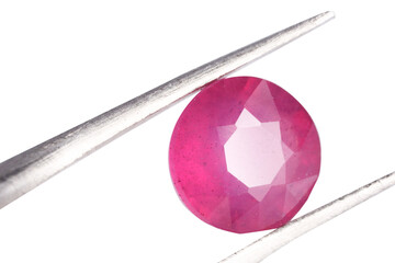 Tweezers with shiny pink gemstone isolated on white