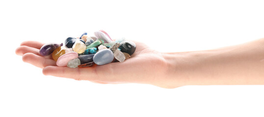 Woman holding different natural mineral stones on white background, closeup