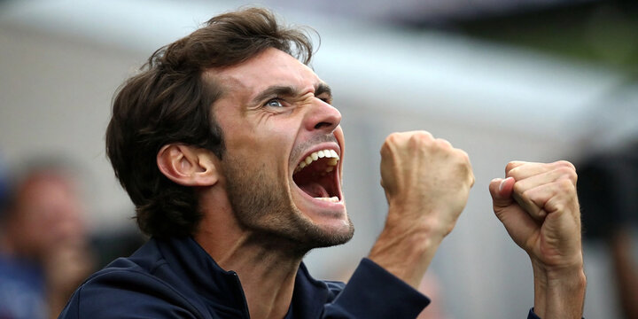 A Close-Up of an Emotional Brunette Man with Hands on His Face