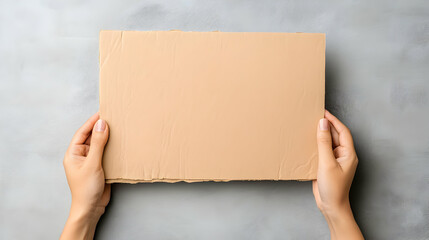 Fototapeta premium A woman holding a cardboard sign