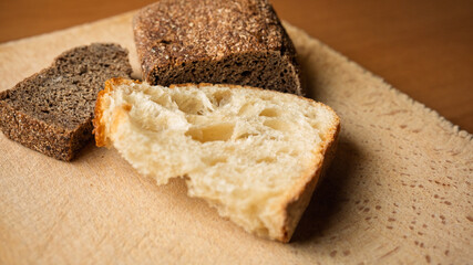 Freshly baked bread displayed on a rustic wooden surface