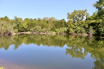 Fototapeta premium The quiet lake in the countryside on a sunny day.