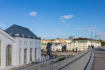 Fototapeta premium Moscow, Russia - August 24, 2024: View from the bridge of the GES-2 House of Culture, the river, and buildings on the opposite bank.