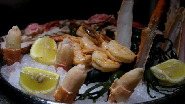 Serving crab in a restaurant. Fresh crab dish. Beautiful serving of a whole crab on ice. Big ready crab on ice.