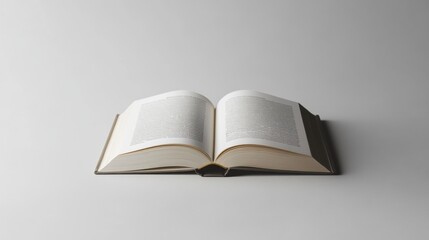 Open Book on a Simple Grey Background Showcasing Pages and Text