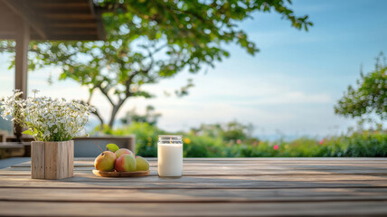 Rustic wooden table with fruit and flowers in garden setting