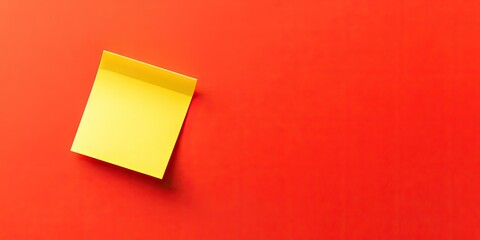 Yellow sticky note positioned in the top right corner on a vibrant orangered background with ample business setting copy space below