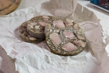 Sliced ​​lean beef placed on crumpled paper. Pig slaughtering products