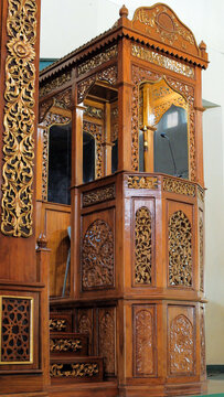The mosque's minbar is made of carved wood as a place for the imam to stand