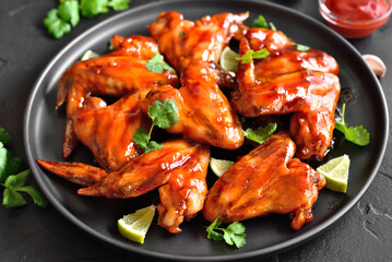 Baked chicken wings on plate