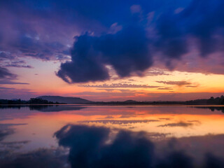 Fototapeta premium Morning light, mountain range, clouds, reflections on water