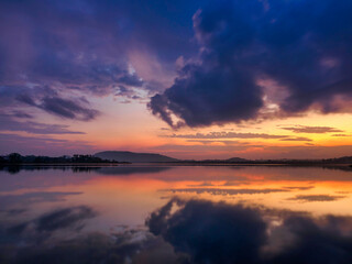 Fototapeta premium Morning light, mountain range, clouds, reflections on water