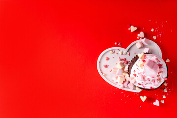 Valentine day tasty double chocolate cupcakes treat with whipped cream, heart shaped marshmallow...