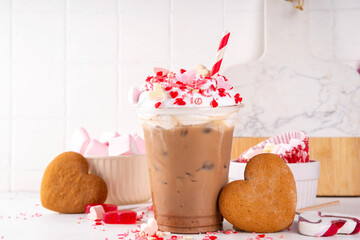 Valentine day iced coffee latte drink  with whipped cream, heart shaped marshmallow and sugar...