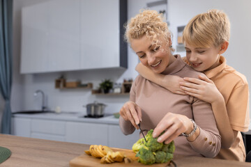 Mother and Son Cooking Together in a Modern Kitchen at Home