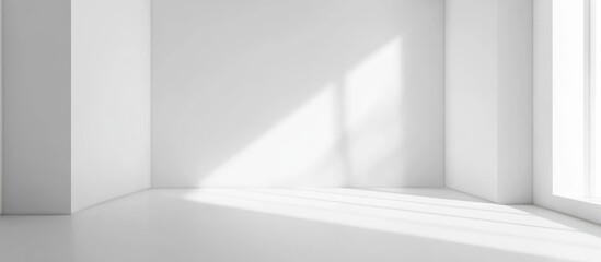 Obraz premium Minimalist white studio interior with immaculate walls and natural light perfect for showcasing products in a clean and modern space