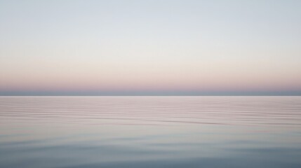 Obraz premium Soft gradient fill over calm waters at sunset highlighting tranquility and natural beauty