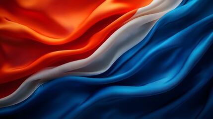 A vivid silk textured abstract flag featuring a stunning blend of red white and blue colors appears to wave softly and gracefully in the breeze creating a dynamic and elegant visual display