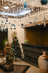 beautiful christmas tree decoration red gold bulbs and ornaments isolated for small room interior details
