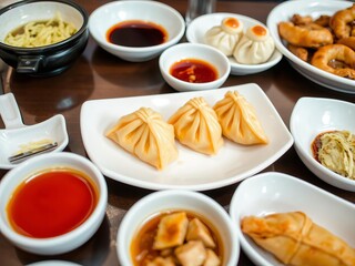 Close-up shot of delicious yaki gyoza dumplings topped with savory sauce, appetizer, Asian food, snack