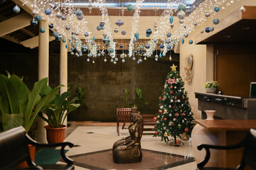 Beautiful Christmas decorations in an old-fashioned house with blue and silver balls hanging for family events and celebrations with loved ones