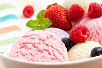Mixed ice cream scoops and berry fruits closeup