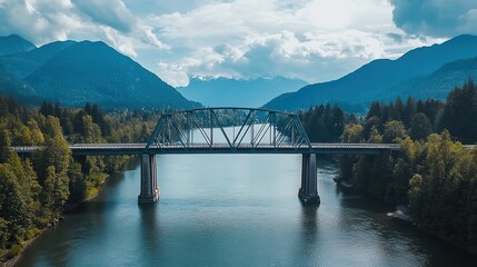 Obraz premium A modern steel bridge crossing a wide river, with sleek architecture blending into the landscape.