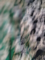 Teal black green grainy gradient abstract background, color blending effect with grainy noise texture