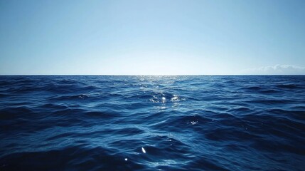 Obraz premium Blue sea gradient background blending oceanic shades under a cloudless, light-reflecting sky.