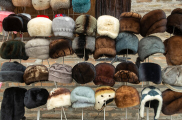 Colorful natural handmade fur hats with long hair in bazaar in Bukhara, Uzbekistan
