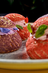 A delicate and elegant French choux pastry, or profiterole, filled with a light and airy lavender cream and topped with edible lavender flowers.