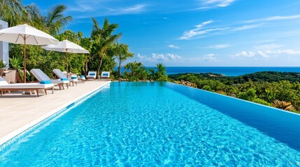 Fototapeta premium Clear blue water in a modern pool with palm trees. A serene pool surrounded by lush tropical beauty