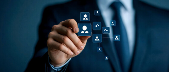 Obraz premium A professional in a suit interacts with digital icons representing networking and connections in a tech-oriented environment.