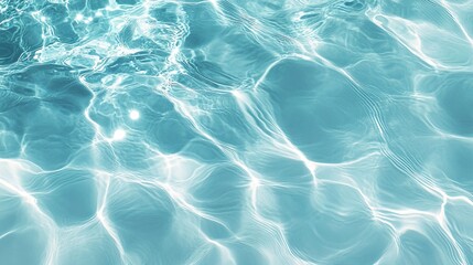 Obraz premium Transparent blue water surface with ripples, bubbles, and sunlight reflections, creating a refreshing summer banner with copy space for cosmetic products.