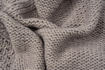 Grey wool sweater texture as a background.