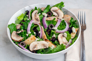salad with  chicken, black olives, goat cheese,  and mushrooms