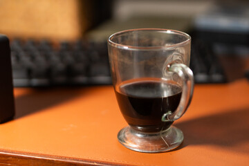 Coffee in a Glass Cup on a Desk