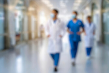 blurred for background. blurred figures of doctors and nurses in a hospital corridor. Doctors and nurses walking in hospital hallway. blurred motion. Moving human figure in the clinic corridor