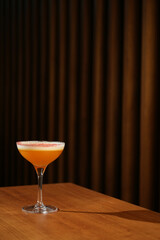 Close up of a cocktail in a glass with lavender and cream. Japanese Whisky Sour cocktail