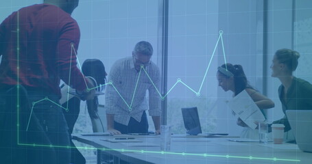 Image of financial data processing over diverse business people in office