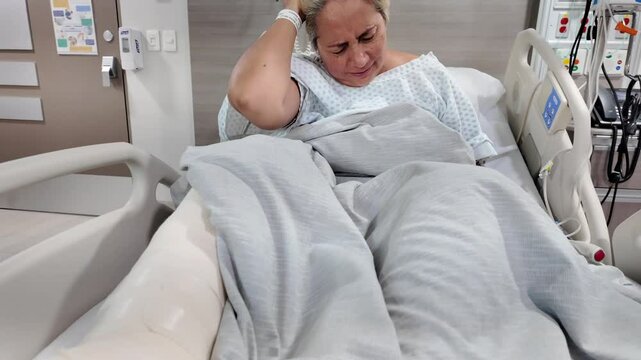 A woman in a hospital bed with a cast on her leg