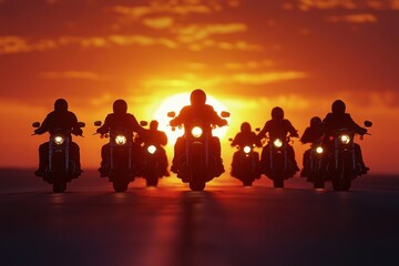 A group of motorcyclists ride down a road at sunset
