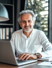 Obraz premium Businessman Sitting at a Table with a Computer