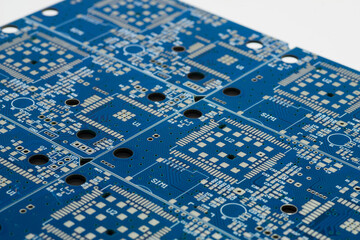 Close-up detailed view of printed circuit board panel in blue with intricate designs