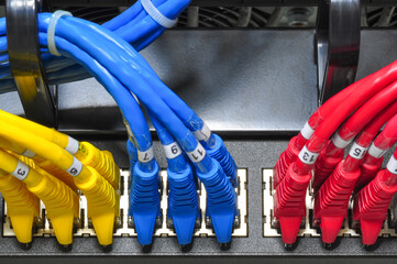 Colorful ethernet cables connected to a network switch in a data center