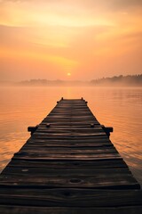 Naklejka premium A peaceful lake at sunrise where the dock vanishes into a soft golden haze. 