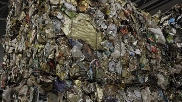 Garbage Recycling Factory, not compostable home equipment, aluminium cans, Plastic cubes for recycle Plant, rubbish warehouse collection. Preparation of recyclables for recycling